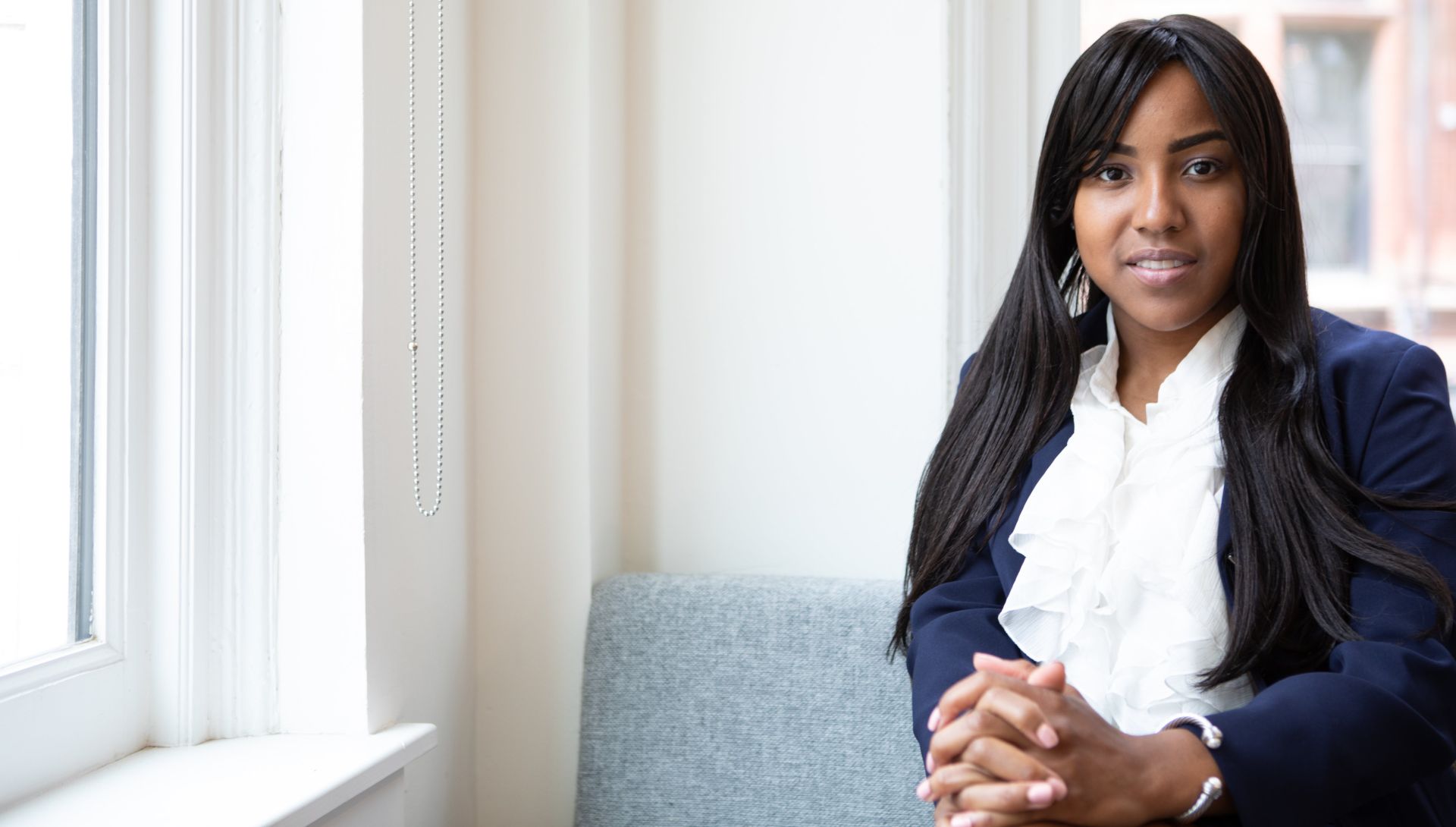 Photo of Woman Sitting on Sofa